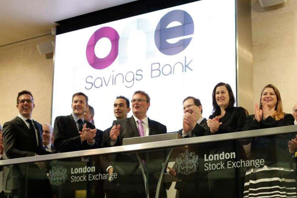 OneSavings Bank celebrates the company's launch on the London Stock Exchange, with chief executive Andy Golding, centre