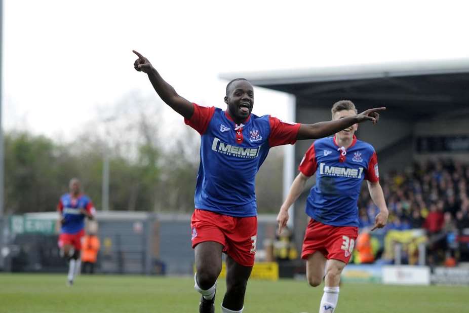 Nathan Nyafli celebrates scoring for Gillingham at Burton Albion
