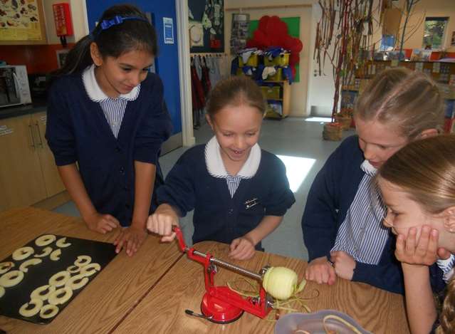 Pupils at The Granville School peeling apples