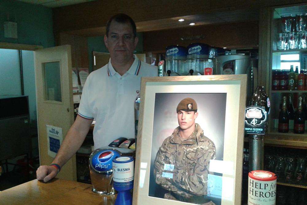 Duane Ashworth with a picture of his son, Lance Corporal James Ashworth, who was awarded the Victoria Cross