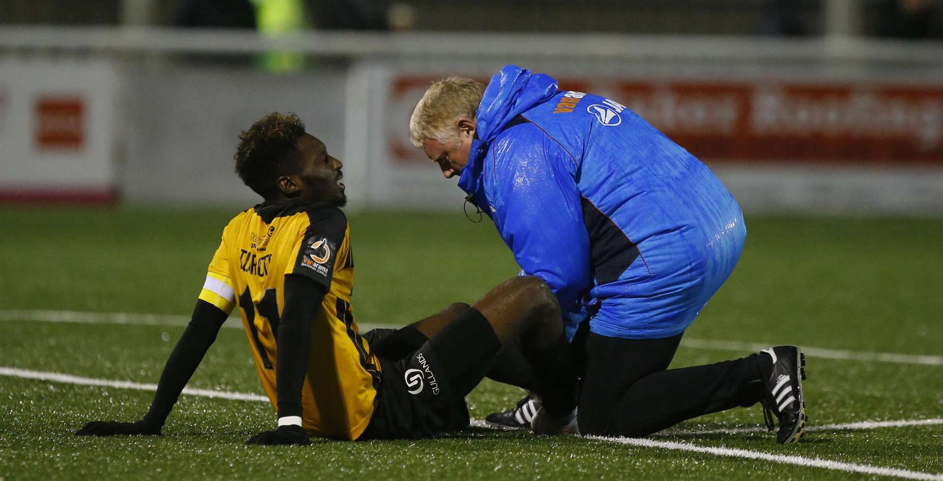 Maidstone striker Blair Turgott needs attention before leaving the field Picture: Andy Jones