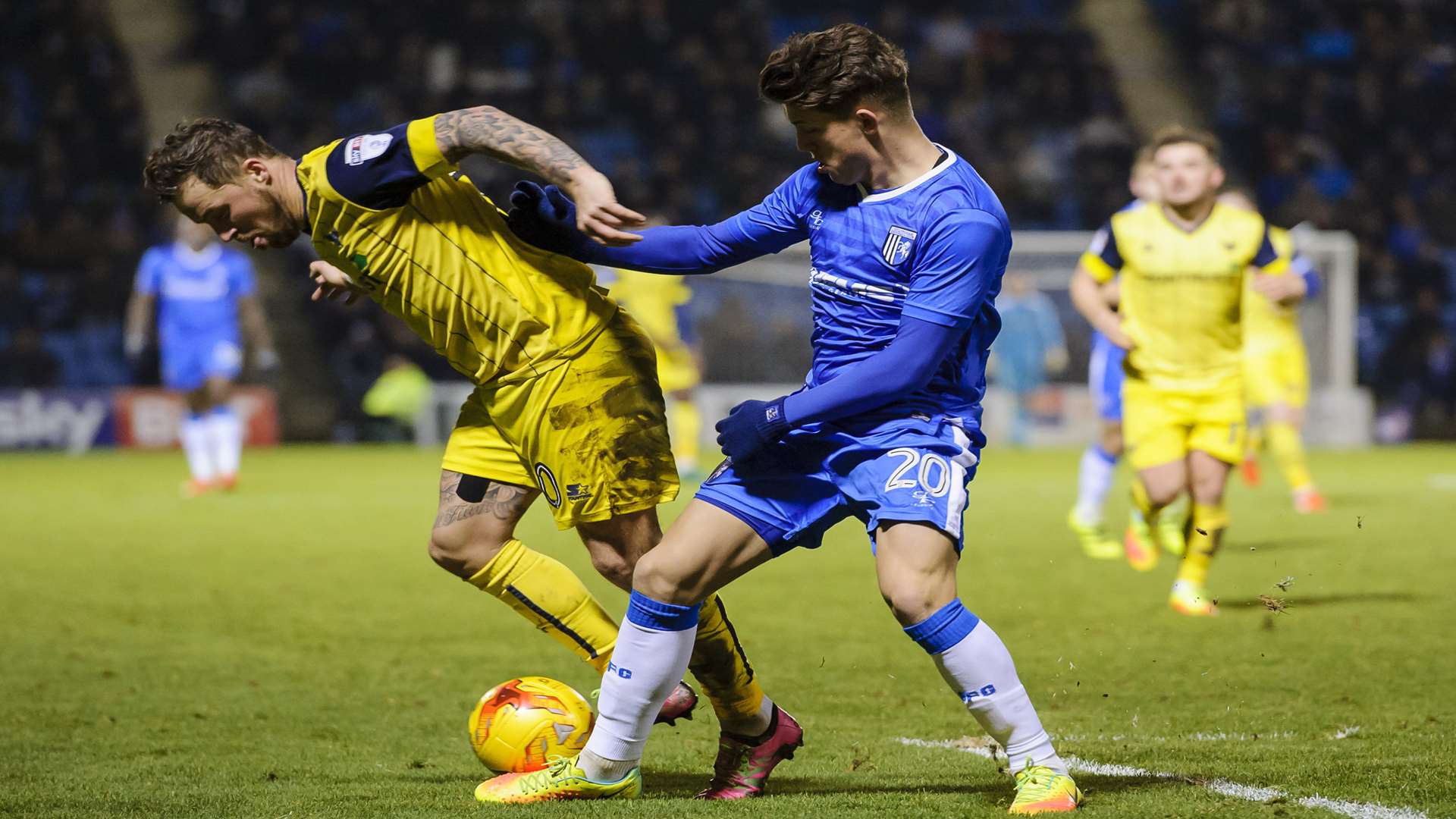 Darren Oldaker puts pressure on Chris Maguire Picture: Andy Payton