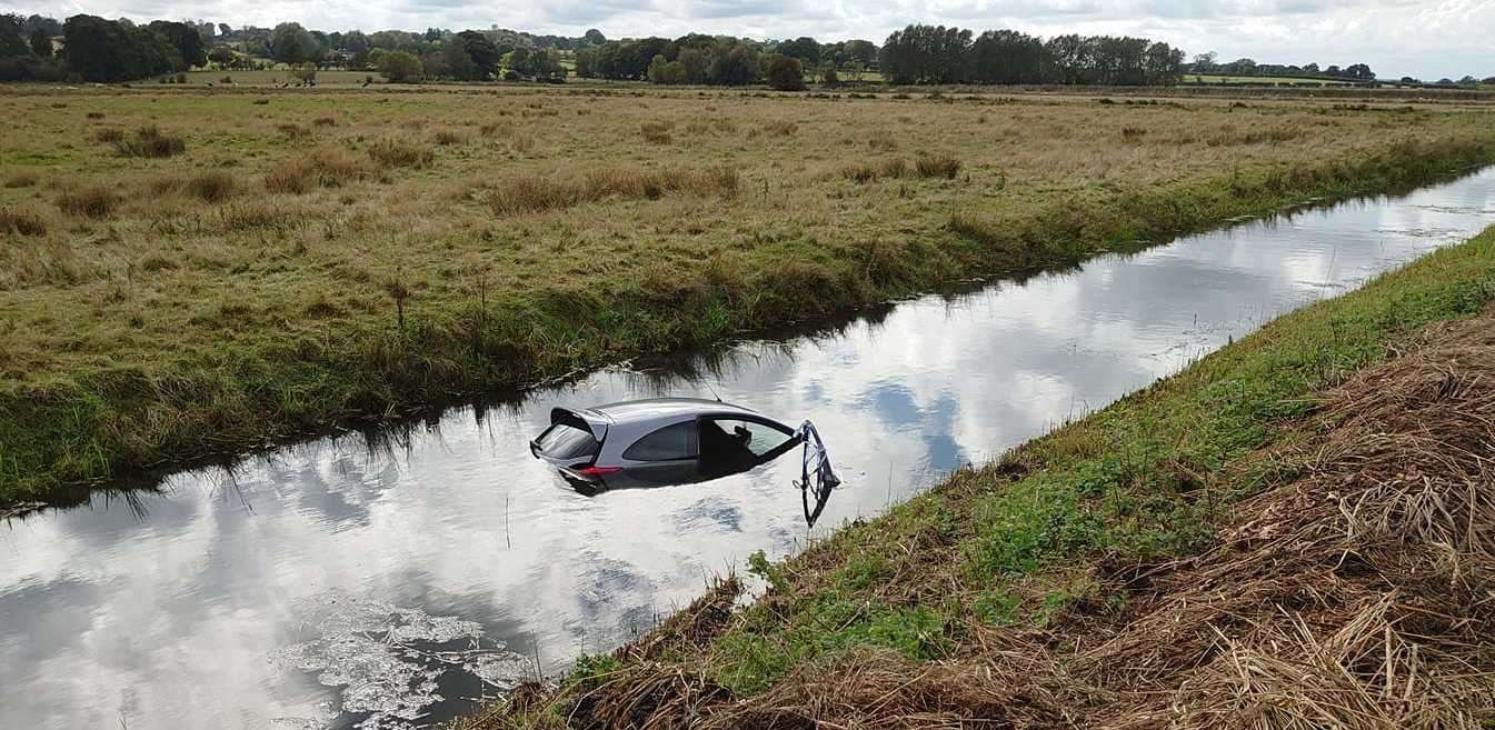 A Ford KA has been submerged in the water. Photo: Dave Spicer
