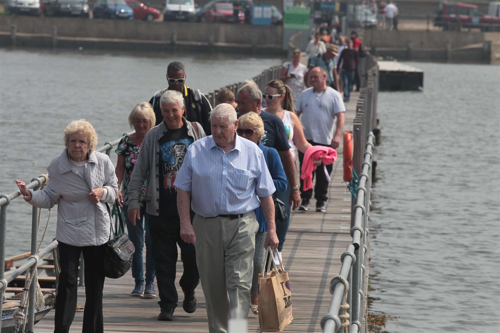 Passengers walking along the all-tide landing at Queenborough to join the Spirit of Sheppey on Saturday on their way to Southend. Picture: John Westhrop