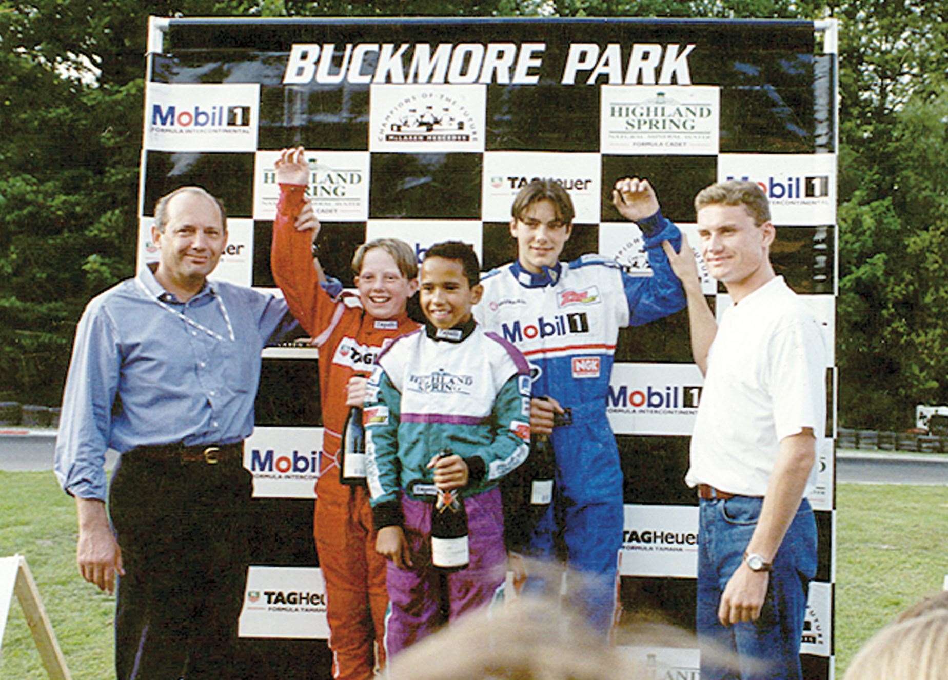 Lewis Hamilton with former McLaren boss Ron Dennis and 13-time Grand Prix winner David Coulthard at Buckmore in 1996