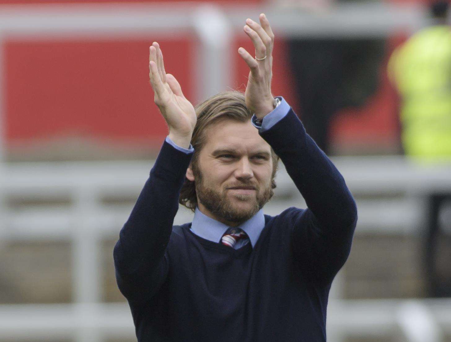 Fleet manager Daryl McMahon applauds the fans after the game. Picture: Andy Payton
