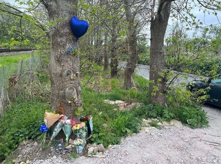 Balloon and floral tributes left for teenage cyclist Cavan in Lower Road, Teynham. Picture: Megan Carr