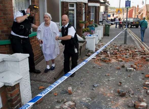 Broken bricks filled the pavement in Blackbull Road and police officers were on hand to help residents.