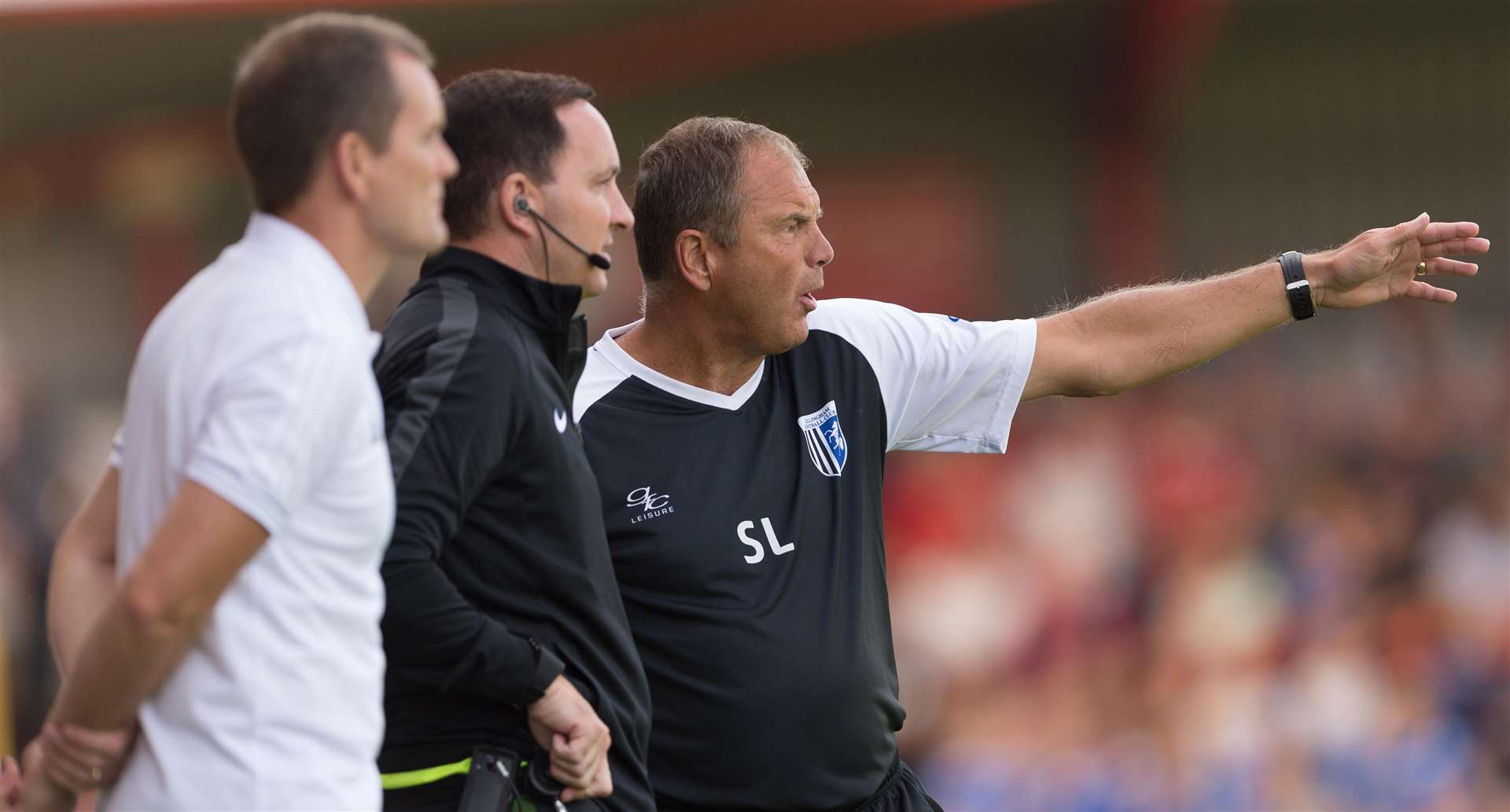 Gillingham boss Steve Lovell makes his point to fourth official Joe Johnson. Picture: Ady Kerry
