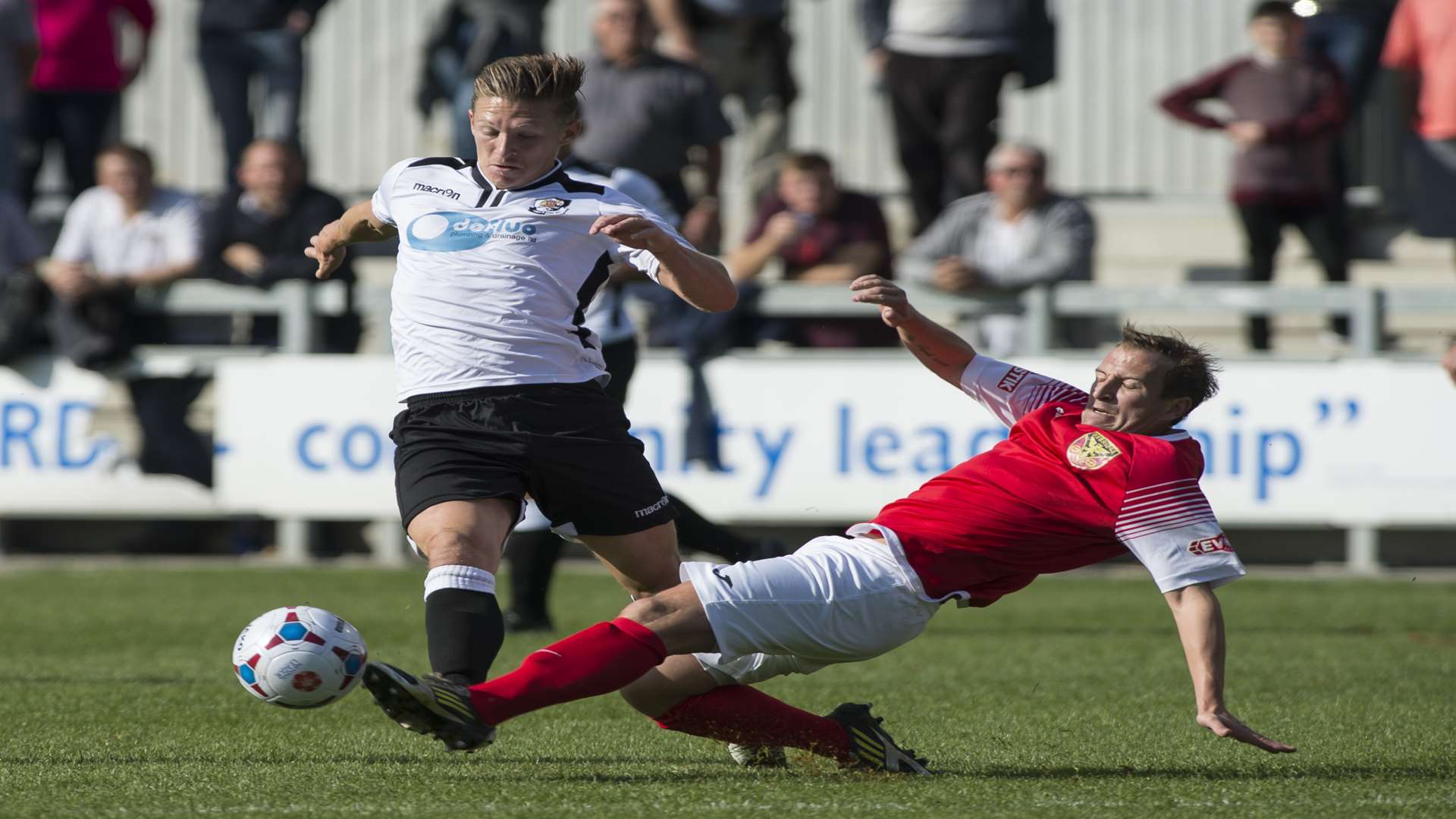 Andy Pugh is tackled during Dartford's FA Cup defeat against Uxbridge Picture: Andy Payton