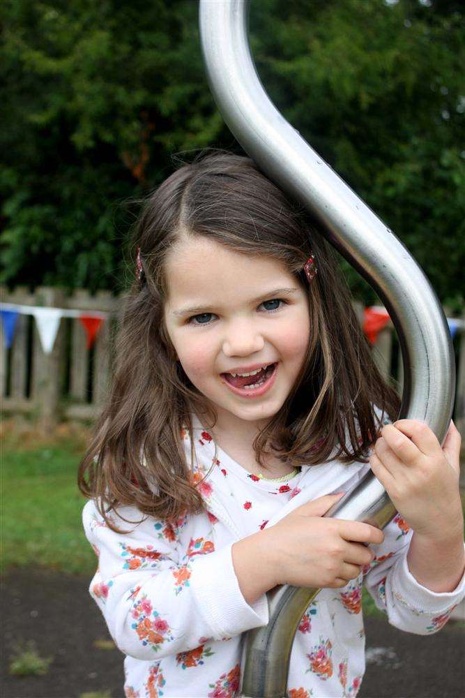 Ella, 3, enjoys the playground.