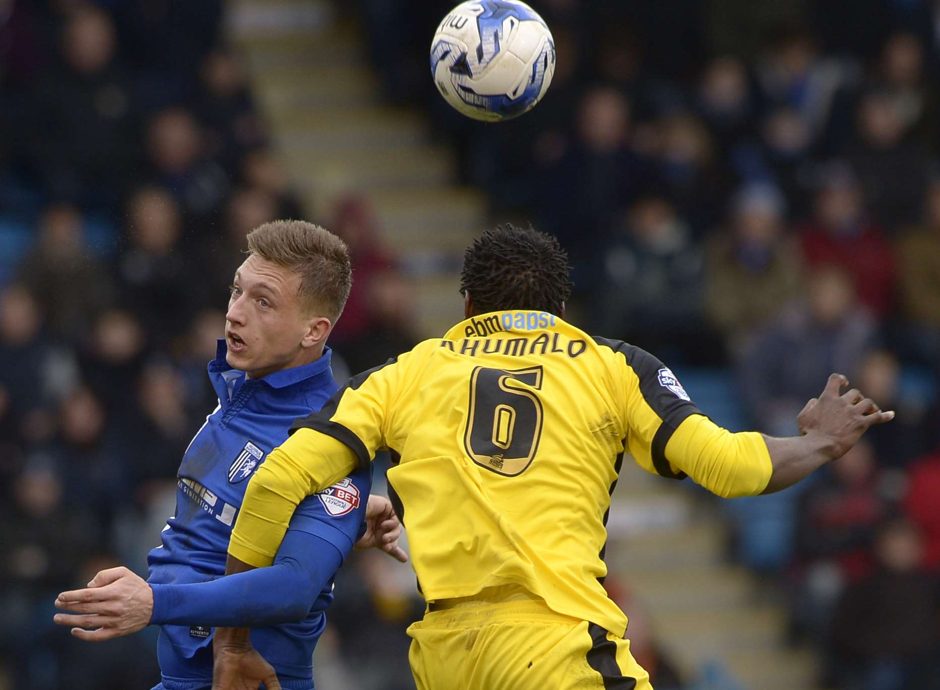 Luke Norris challenges with Colchester's Bongani Khumalo on Saturday. Picture: Barry Goodwin