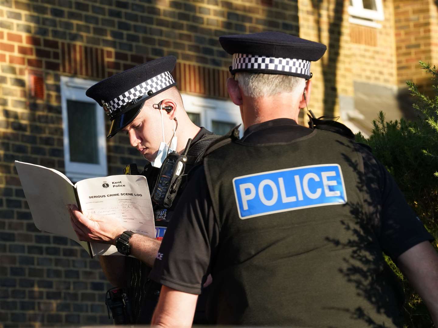 An officer fills in a 'serious crime scene log'. Picture: Andy Clark