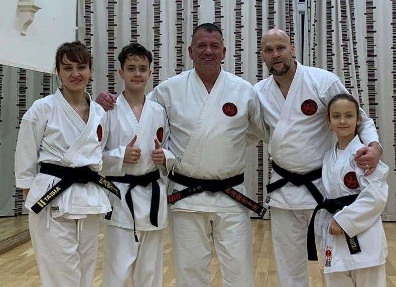 The Ullrich family of Taisia, Daniel, Patryk and Amelia after all made it to black belt in karate, alongside sensei John Bower