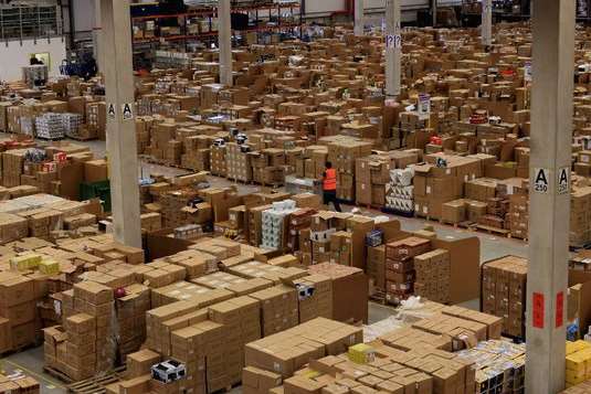 Inside an Amazon logistics warehouse. Rumours about the company opening a new centre in Ashford have been repeatedly denied. Picture from Getty Images and Wiki Commons.