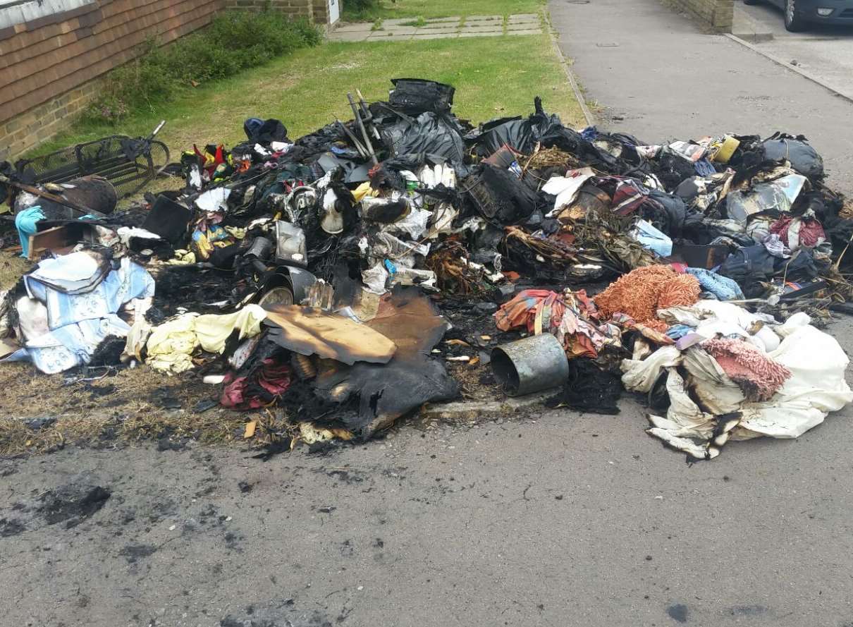 The belongings outside flats in Newtown Green were set on fire