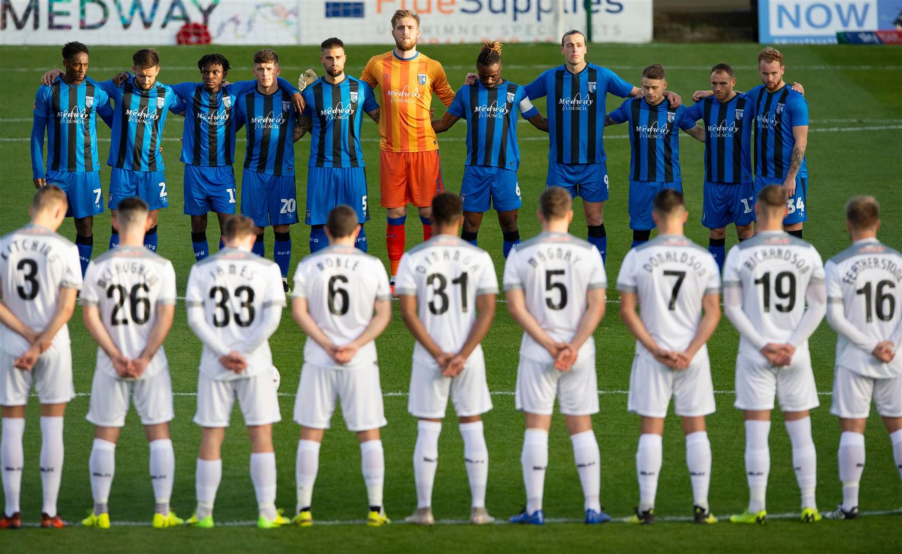 The players observe a minute's silence to mark the 100th anniversary of the end of the First World War Picture: Ady Kerry