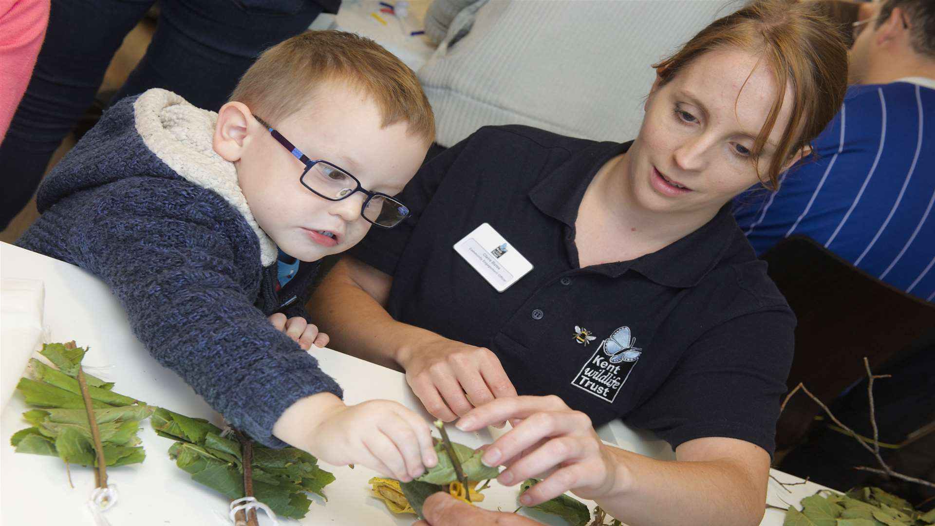 Lewis, three, with Claire Bates from Kent Wildlife Trust