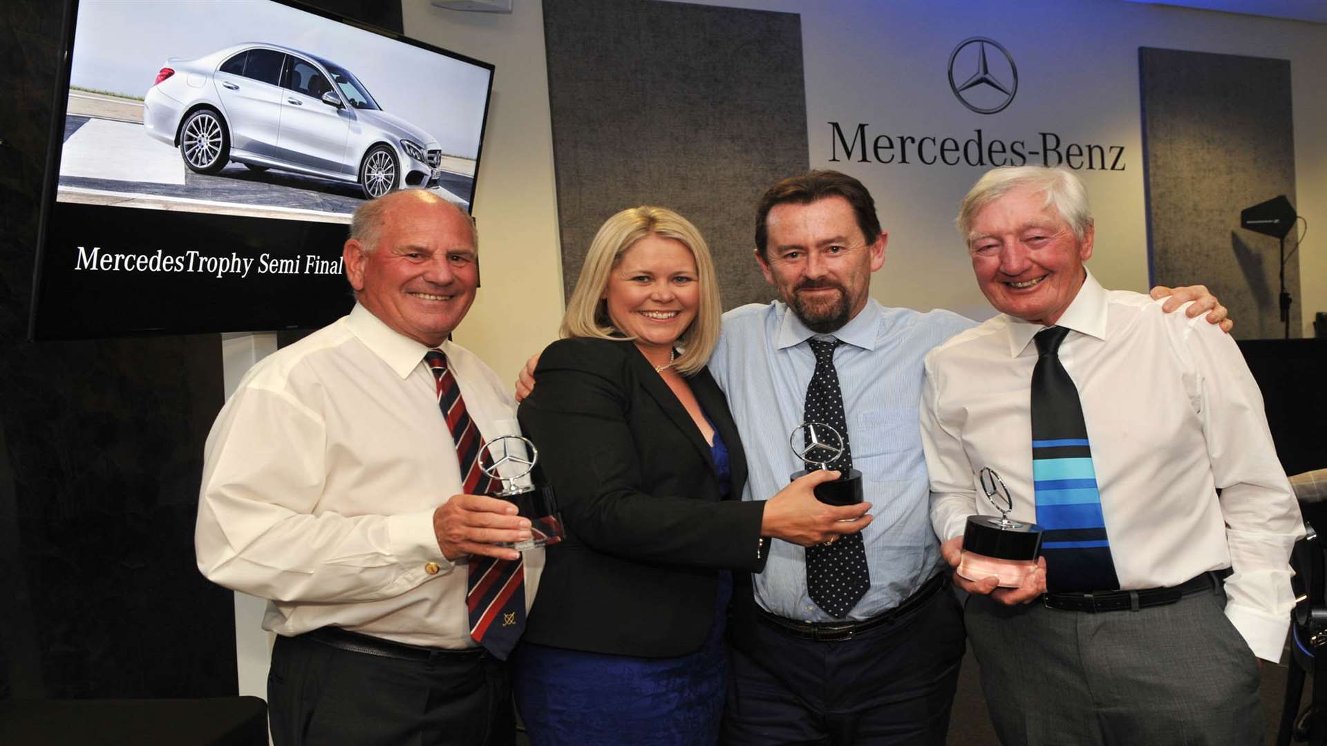 Keith Andrews (left) and Malcolm Wager (second right) are pictured being presented with their prizes at the MercedesTrophy southern semi-final