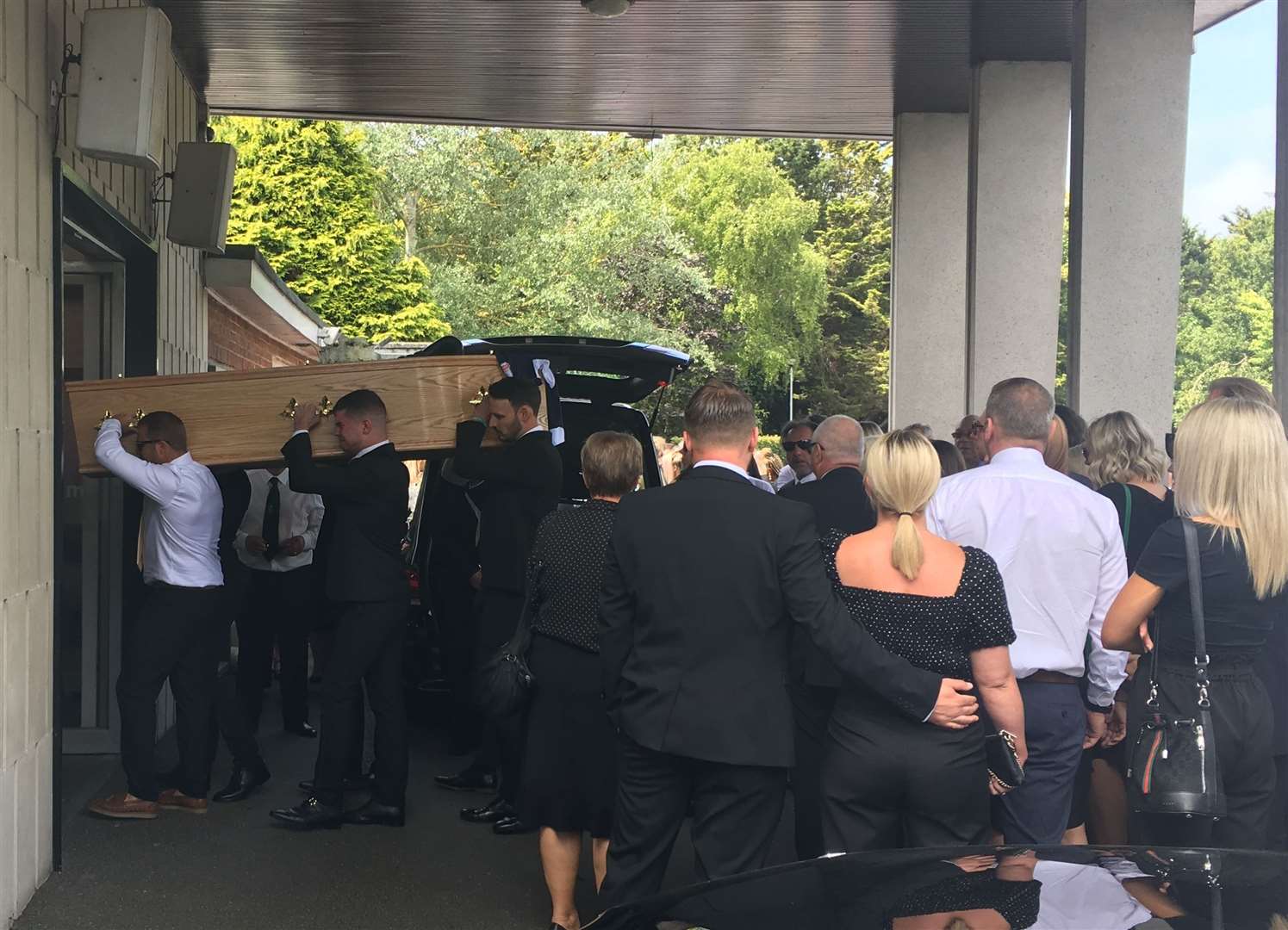 Mr Stone's brothers carried in his coffin to the chapel