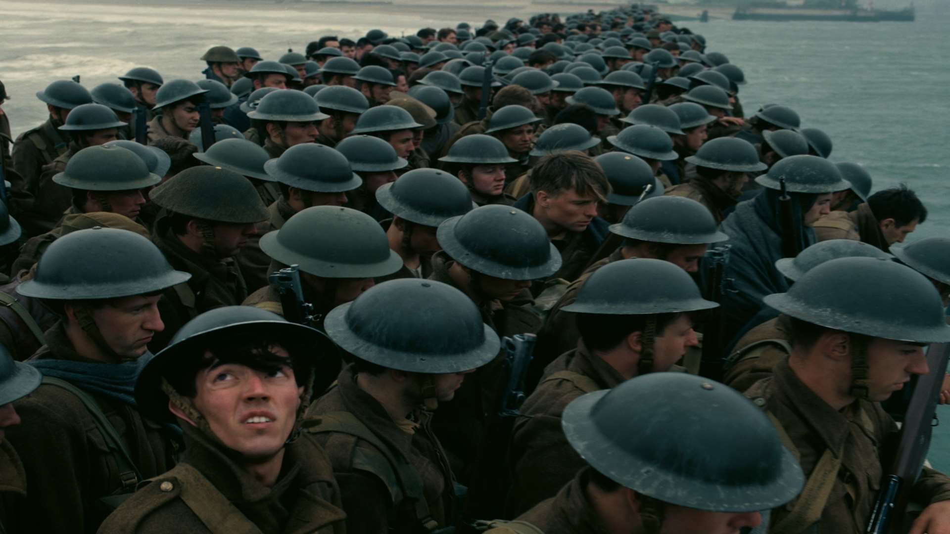 A scene from Christopher Nolan's Dunkirk as troops wait for a rescue from the East Mole of the harbour