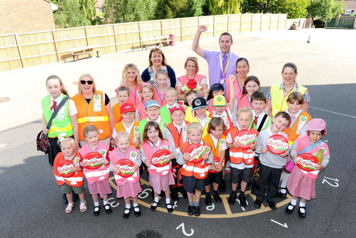 Walderslade Primary School Walking Bus launch. From left (back row) Elizabeth Carr from Babybel and James Sutton, principal road safety officer at Medway Council, with parents, volunteers and children