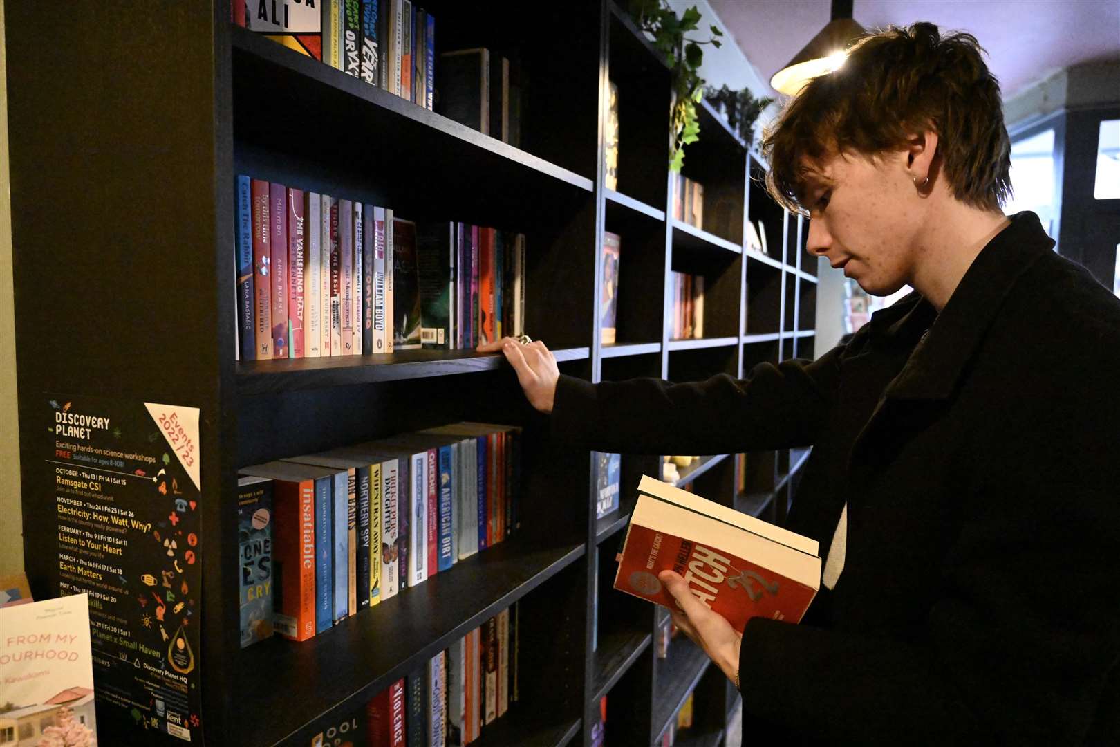 A customer searches through the book shelves in support of the shop. Picture: Barry Goodwin