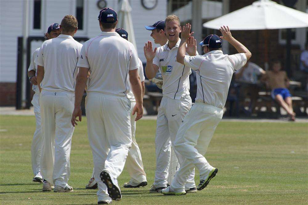 Hartley's Dan Redwood (second right) celebrates a wicket during the win against Blackheath.