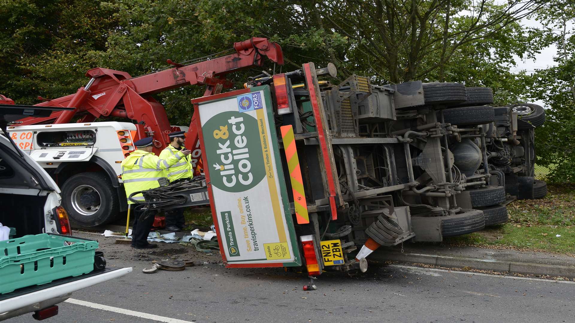 The Travis Perkins lorry on its side. Picture: Paul Amos