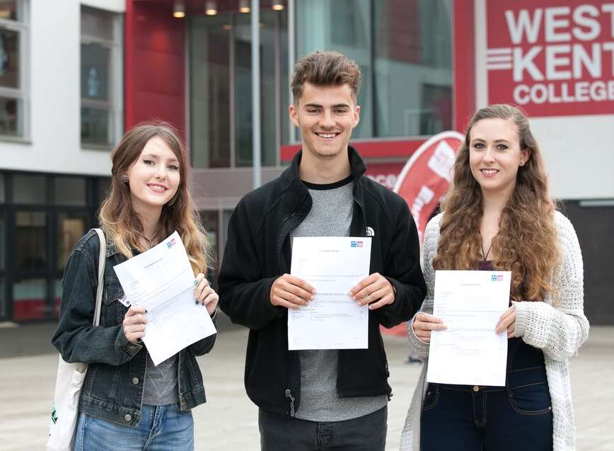 Students Alana Bowen-Burford, Joel Sanders and Julia Ruddel celebrate their exam results