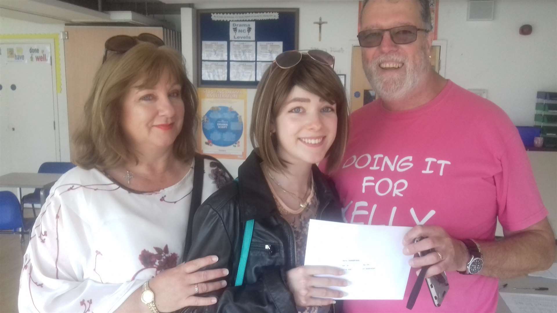 Kelly getting her exam results, pictured with parents Martin and Linda, August 2017. Picture: St Edmund's RC School, Dover