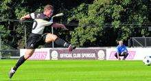 Billy Bricknell fires a shot in on goal.