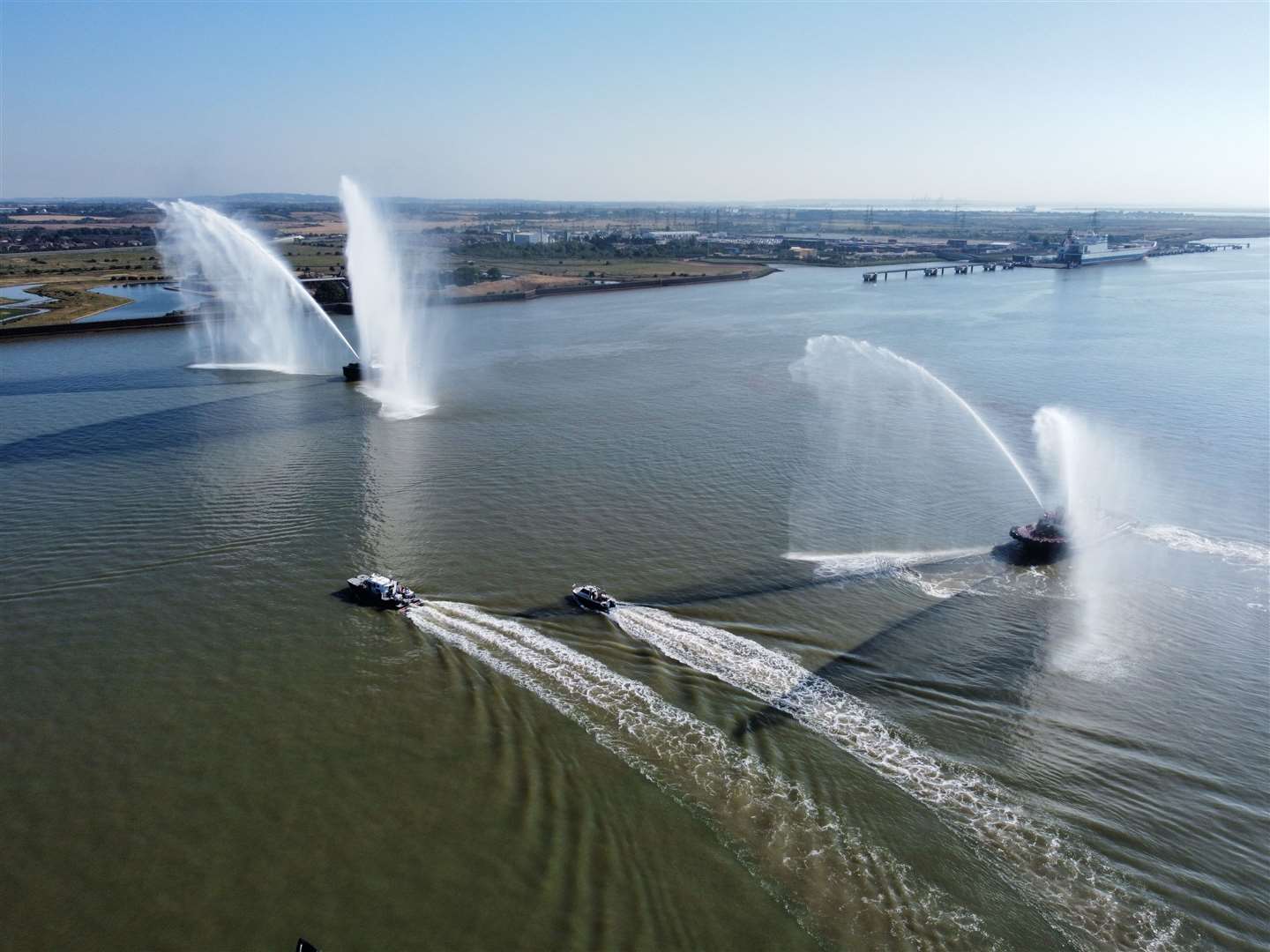 Tugs form a guard of honour on the River Thames as the baton leaves Gravesend. Picture: Jason Arthur