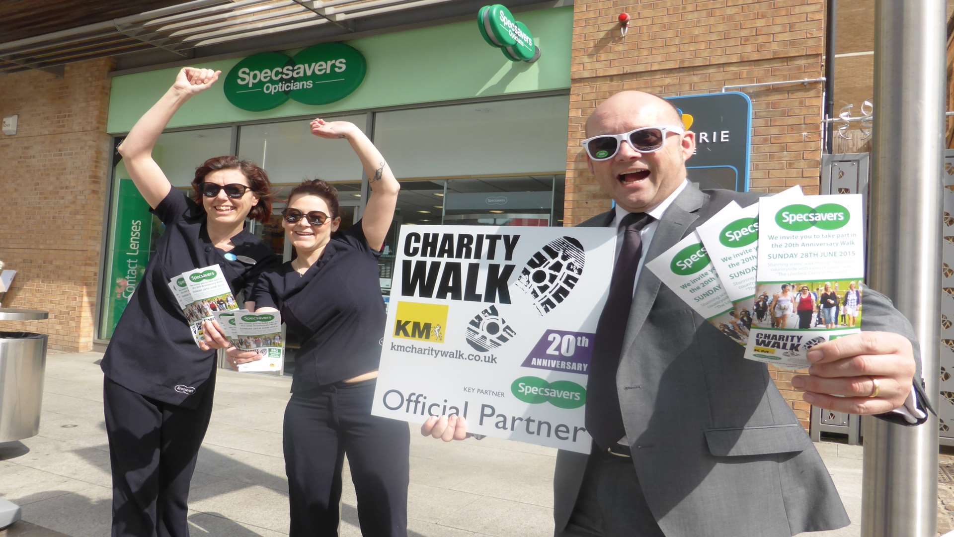Folkestone Specsavers director David Cavender joins Alison Potter and Zoe OBrien to promote the 20th anniversary KM Charity Walk