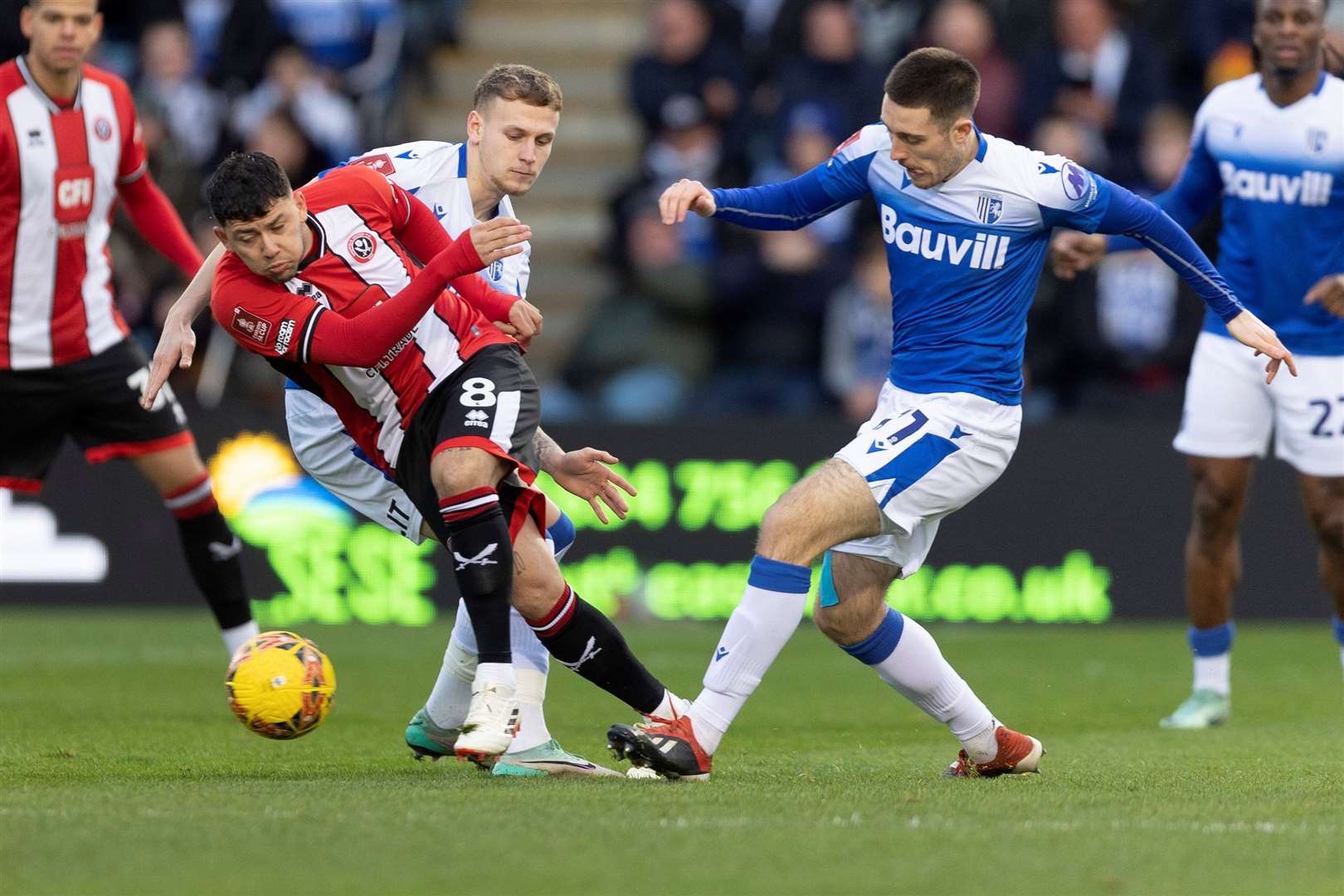 Dom Jefferies and Ethan Coleman challenge for the ball as Gillingham take on Sheffield United Picture: @Julian_KPI