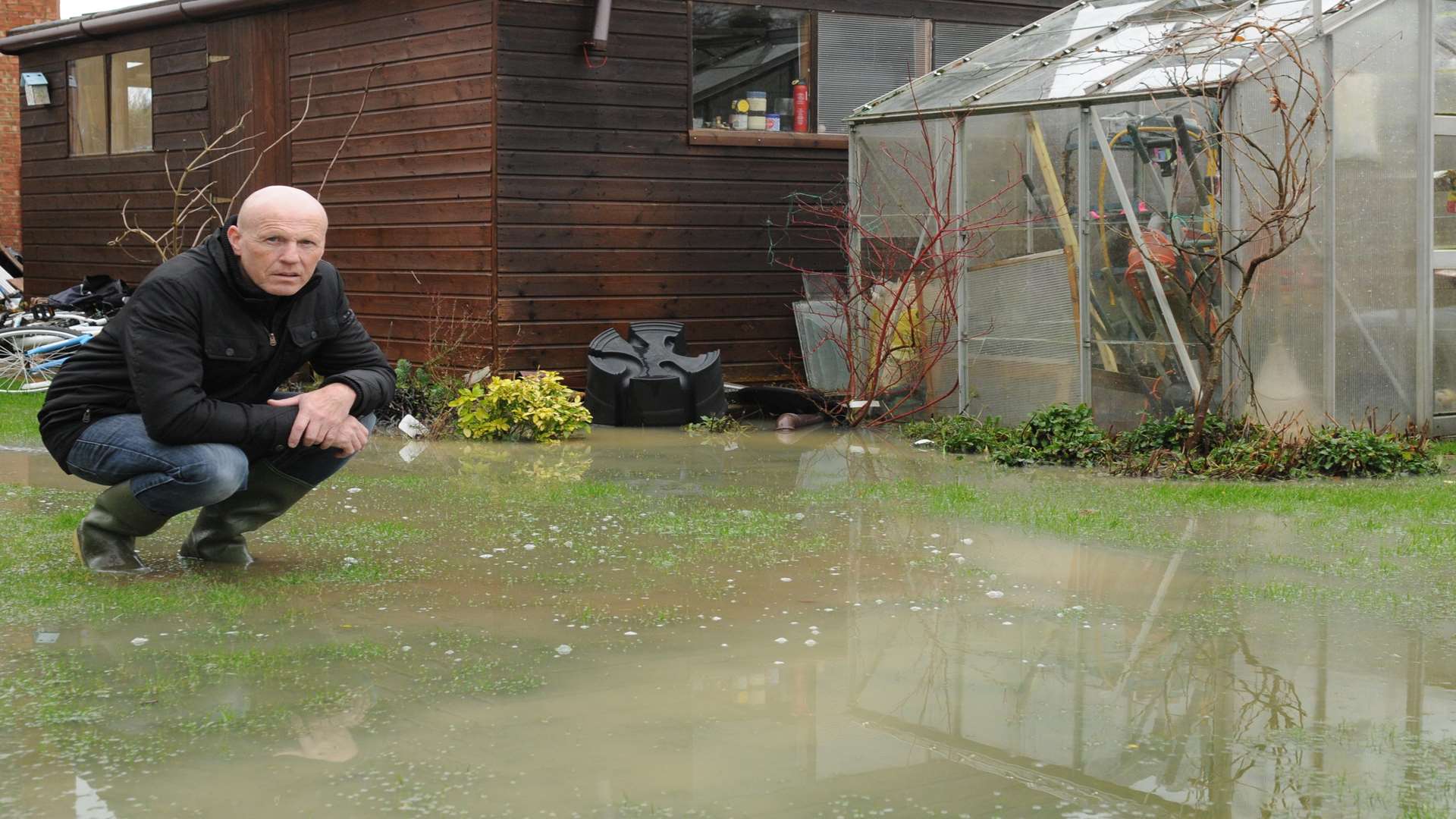 Kevan Barrett in his flooded garden in Kennington