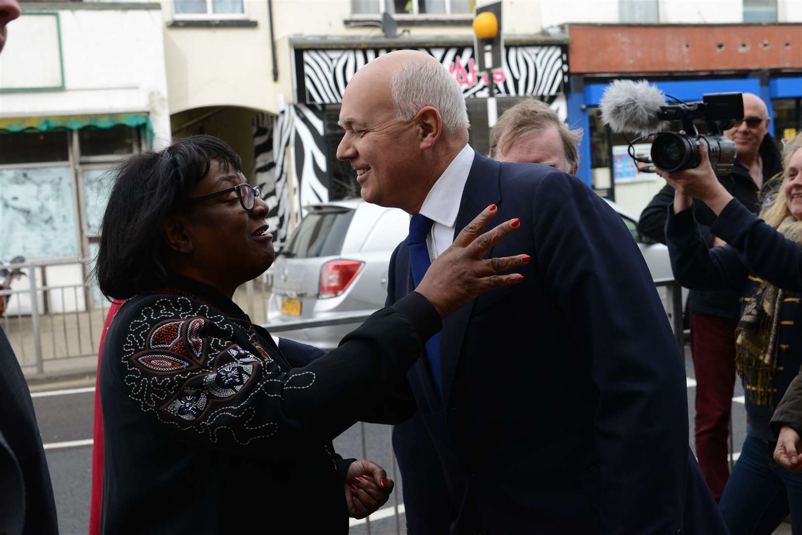 Iain Duncan Smith and Diane Abbott greet each other warmly after meeting unexpectedly in Margate. Picture: Gary Browne.