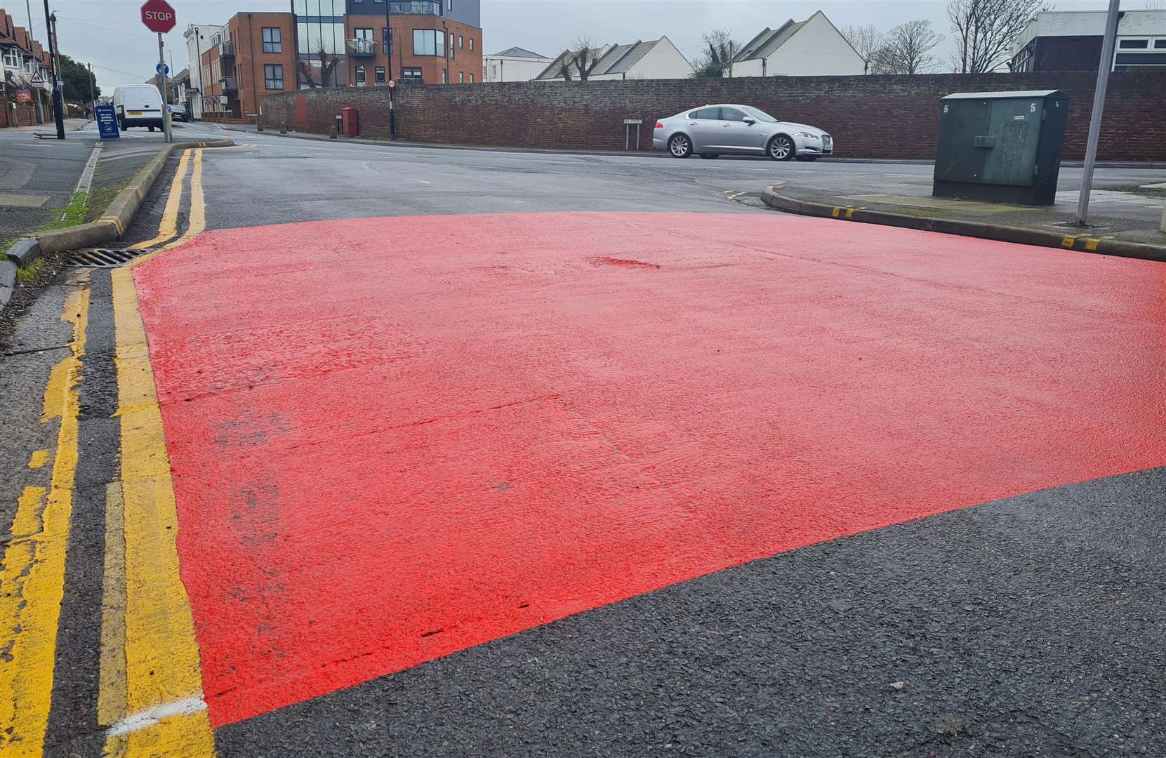 Red paint on the road marks the new 20mph zone at the junction of The Broadway and Sea Street in Herne Bay
