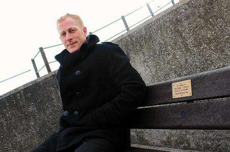 Seafront officer Ian Arnell on the bench installed in memory of volunteer lifeguard Tony Boosey Seafront officer Ian Arnell on the bench installed in memory of volunteer lifeguard Tony Boosey