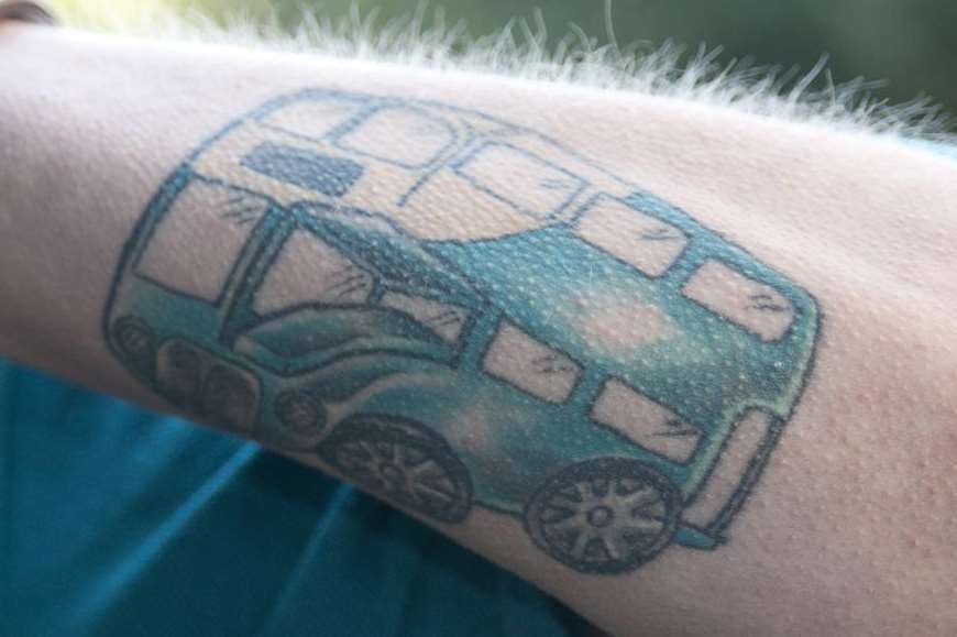 Arriva driver Neil Collins even has a tattoo of a bus
