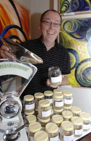Artist Anthony Wait packages up another jar of Margate sand