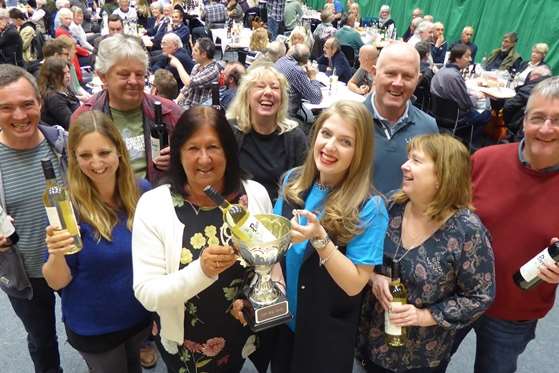 Rebecca Hadley of Barclays (front centre right) presents The Moomins with the trophy for winning the Canterbury heat of the KM Big Charity Quiz.