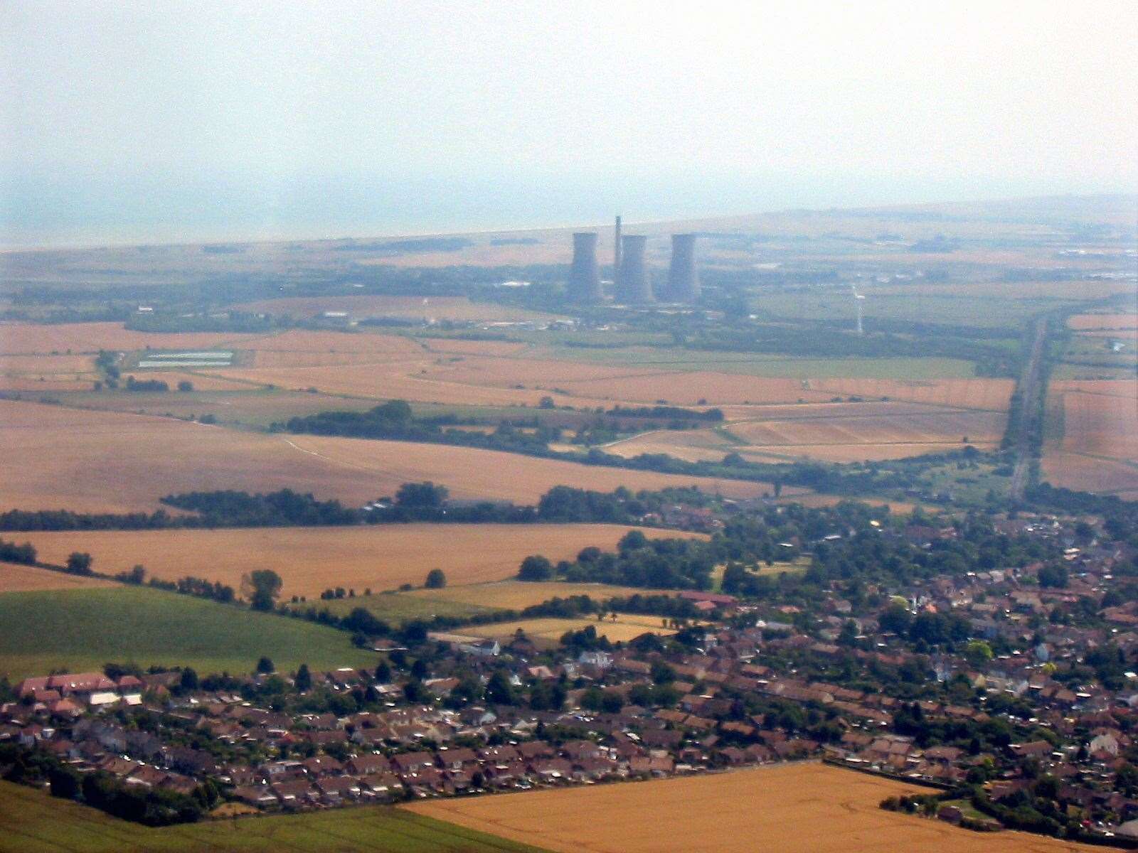 Richborough power station through the haze, and beyond it, Pegwell Bay