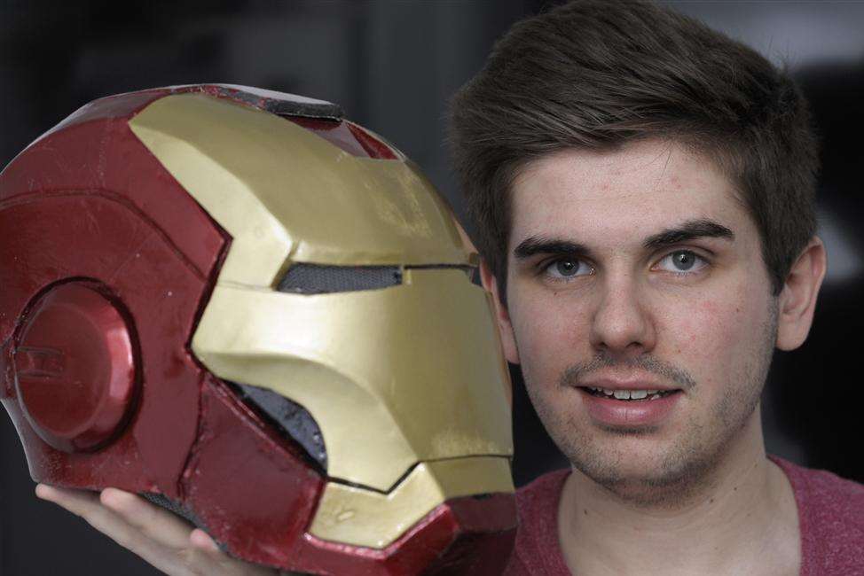 Electronics student Daniel Cooper with the Iron Man helmet he made