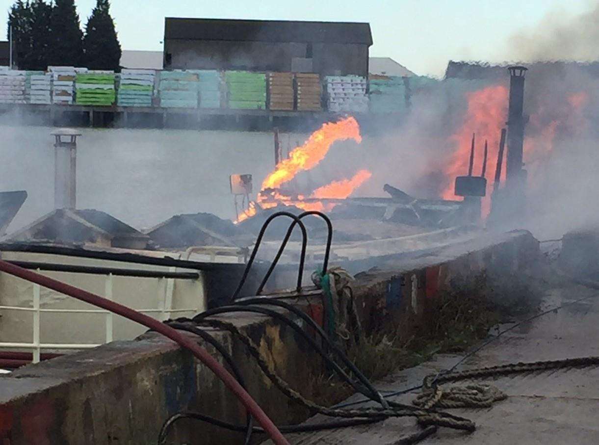 Firefighters tackled the blaze on the 40-foot vessel at Acorn Shipyard