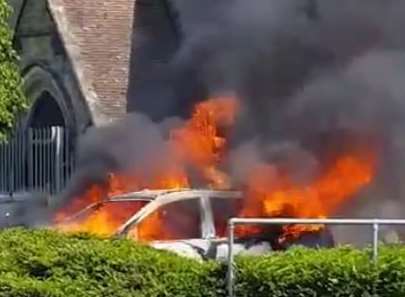 Flames poured from the car. Picture: From video by Octane Hairdressing For Men