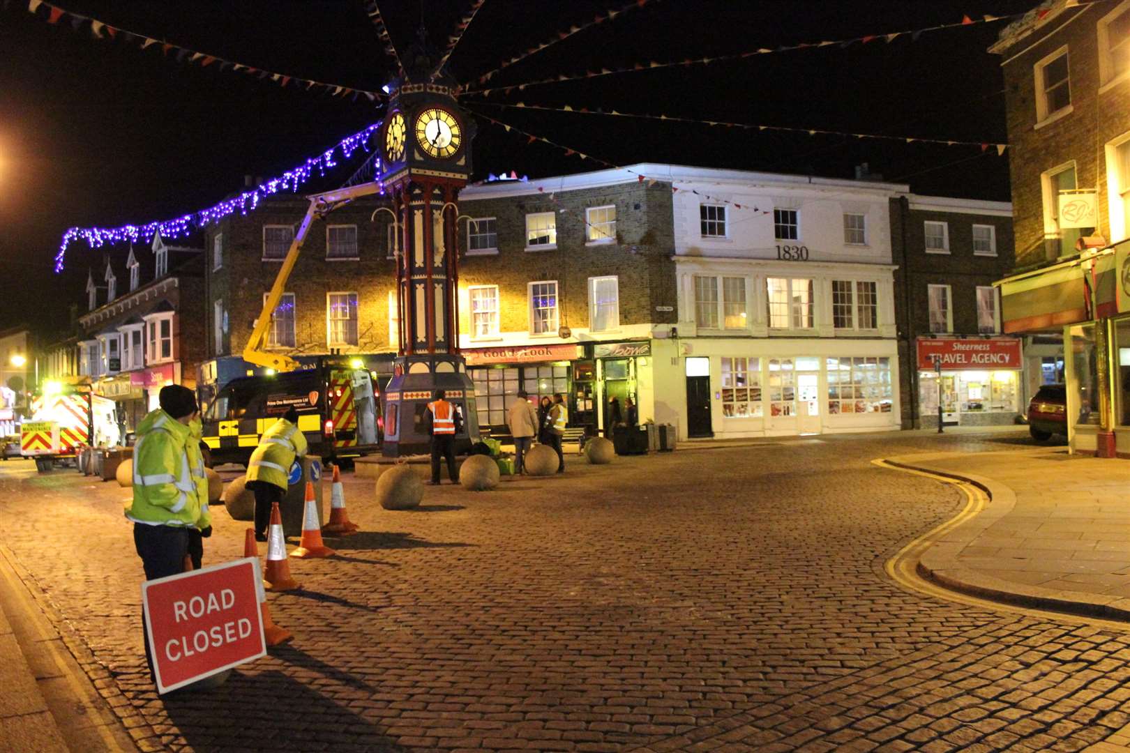 Prime One Maintenance putting up the Christmas lights in Sheerness around the clock tower Road closed