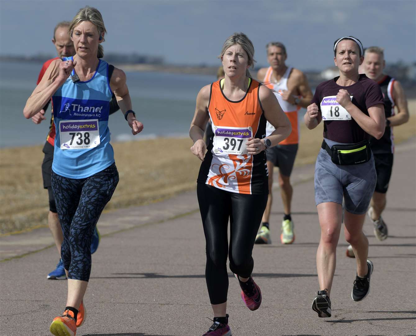 No.738 Julie Williams of Thanet Roadrunners, No.397 Bronwen Lafferty and No.18 Laura Archer make their way along the seafront at Hythe. Picture: Barry Goodwin (63468716)