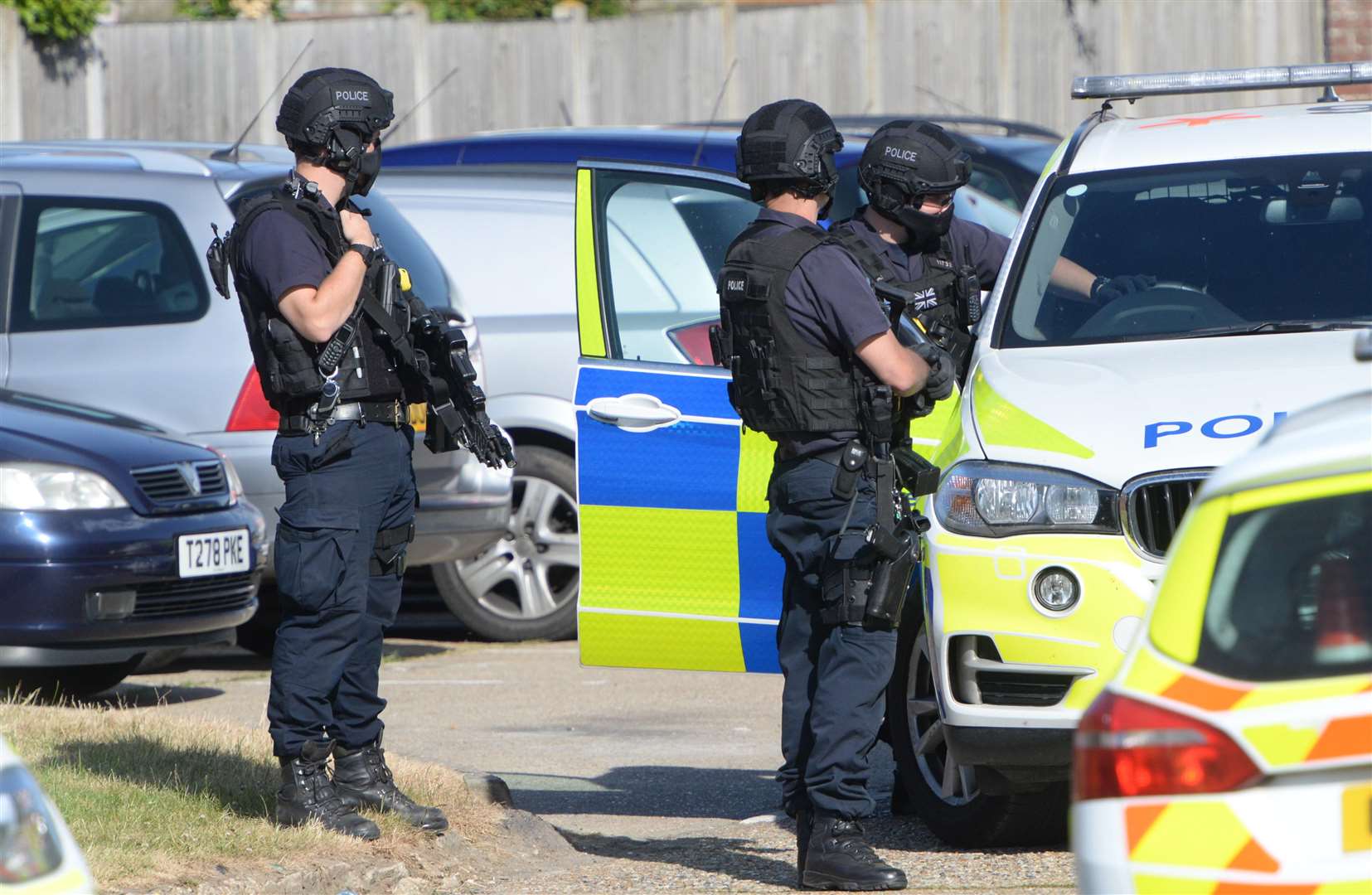 Prepared: The firearms officers at Lucerne Drive. Picture: Chris Davey
