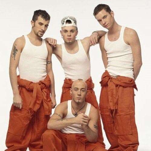 Shaved and tattooed: East 17 in the 1990s complete with orange 'boiler suits' (13030583)